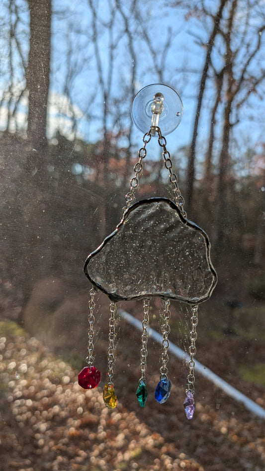 Clouds with rainbow suncatcher